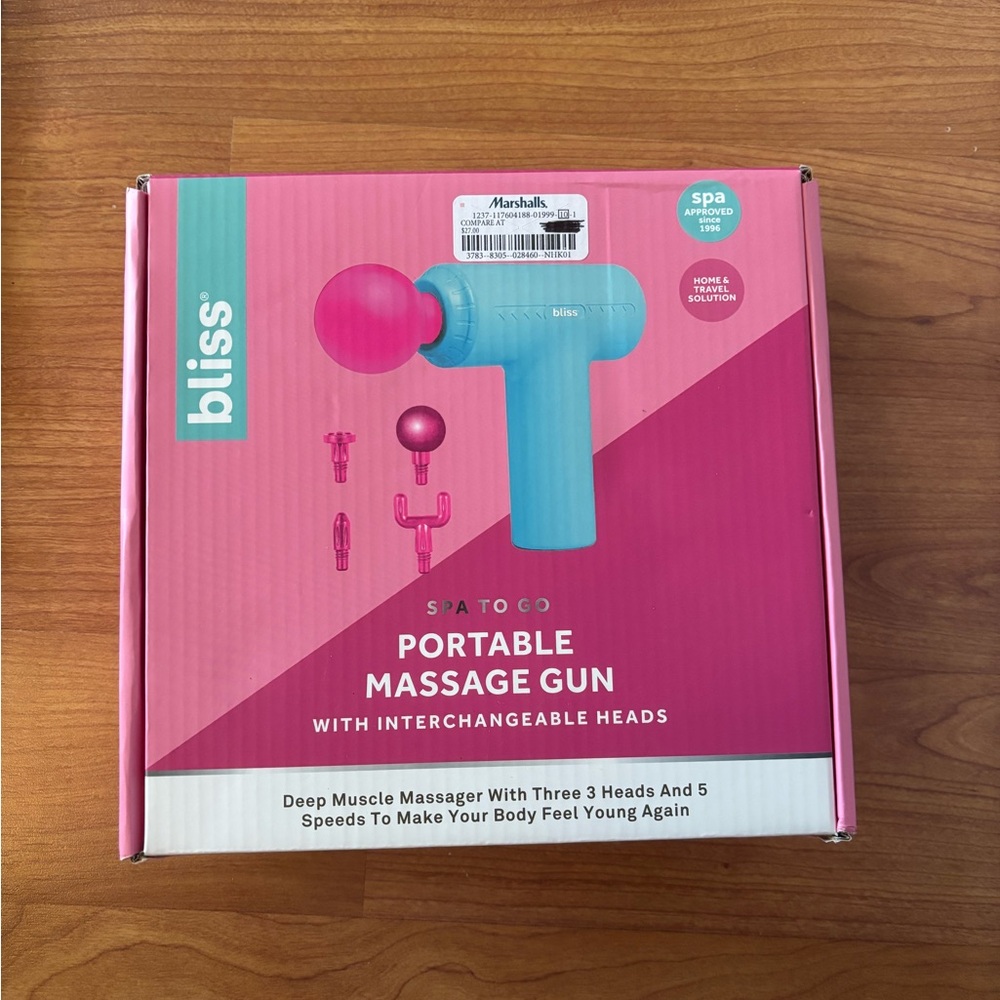 Bliss massage gun in teal and pink box
